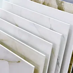 Różne rodzaje gresu, od jasnego marmuru po ciemniejszy kamień. Dowiedz się, jak ciąć gres bez odprysków, by uzyskać idealne wykończenie.